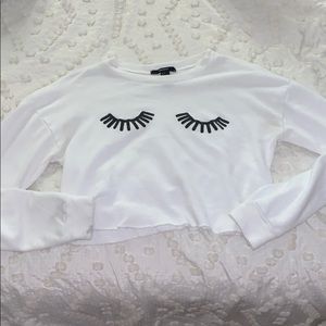 forever 21 white crop sweatshirt eyelashes